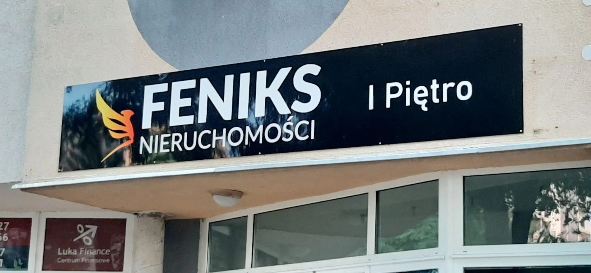 Tablica informacyjna biura nieruchomości Feniks